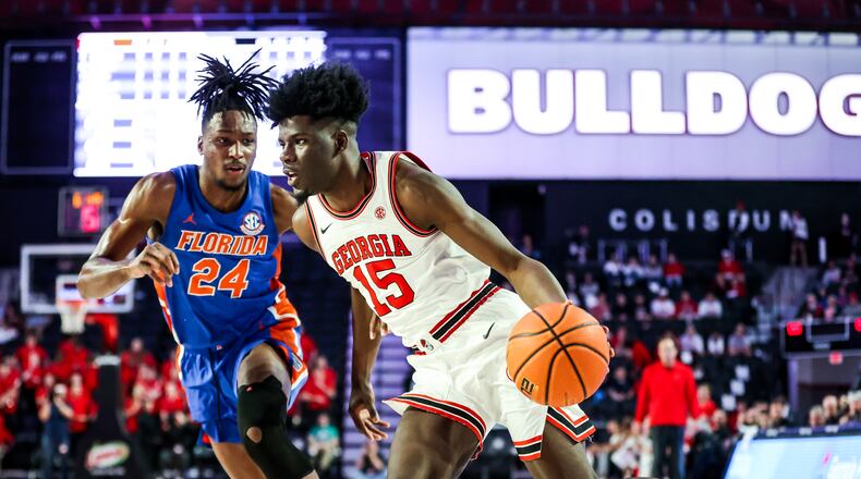 Georgia's Dalen Ridgnal drives the ball against Florida's Philandrous Fleming during Saturday's game at Stegeman Coliseum in Athens. (Photo by Tony Walsh/UGA Athletics)