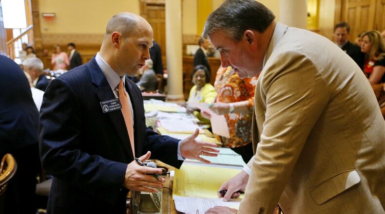 State Sen. Hunter Hill, R-Smyrna (left), during Thursday’s legislative session. BOB ANDRES / BANDRES@AJC.COM