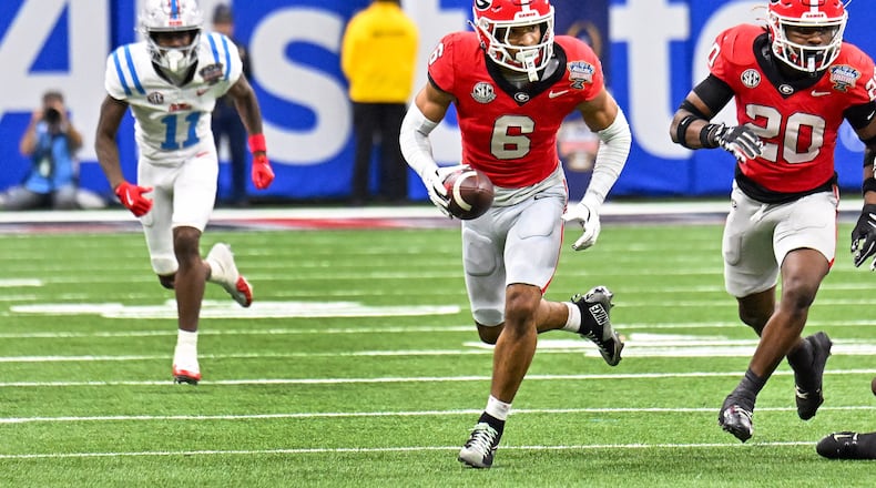 Georgia Bulldogs defensive back Daylen Everette (6) recovers a fumble from Ole Miss for a 47-yard touchdown run during the second quarter of the NCAA College Football Playoff quarterfinal game at the Sugar Bowl in the Caesars Superdome, Thursday, Jan. 1, 2026, in New Orleans. (Hyosub Shin/AJC)