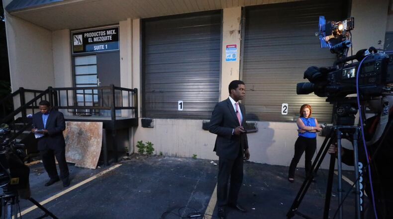 The press cover the scene where police seized more than $6 million worth of cocaine, weapons and cash during a pair of overnight south Fulton County drug raids. A joint task force of Fulton County and DeKalb County police narcotics officers went into a warehouse at 3700 Wendell Dr. in south Fulton around 9 p.m. Wednesday night, Fulton police spokeswoman Det. Melissa Parker told The Atlanta Journal-Constitution. JOHN SPINK/JSPINK@AJC.COM