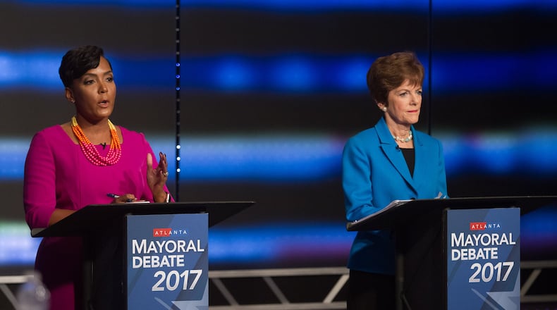 Atlanta mayoral contenders Keisha Lance Bottoms (left) and Mary Norwood speak at the WSB-TV’s live debate Sunday evening, Dec. 3, in Atlanta. The runoff election will be held Tuesday, Dec. 5.