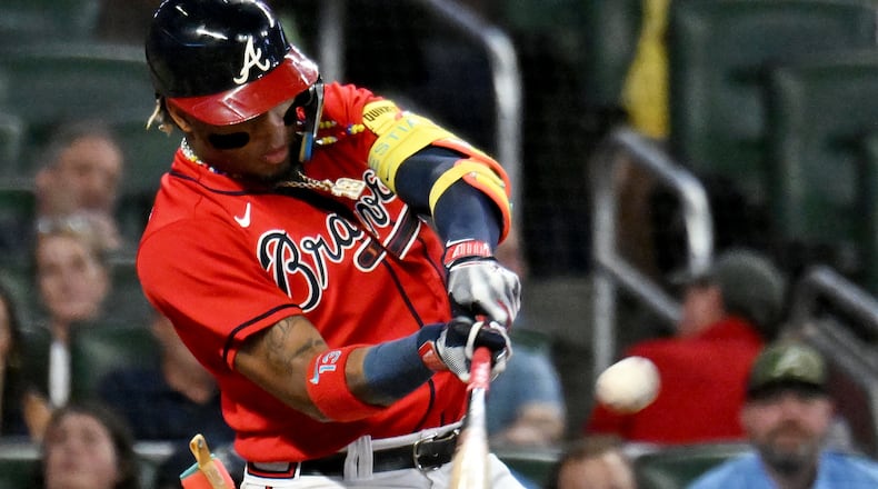 Atlanta Braves' right fielder Ronald Acuna Jr. (13) hits a solo home run during the fourth inning at Truist Park, Friday, September 8, 2023, in Atlanta. (Hyosub Shin / Hyosub.Shin@ajc.com)