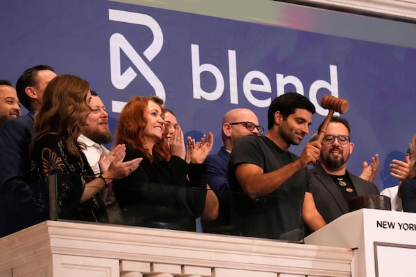 Nima Ghamsari, second from right, Co-Founder & CEO of Blend Labs Inc. gavels trading closed at the New York Stock Exchange, Tuesday, April 29, 2025. (AP Photo/Richard Drew)