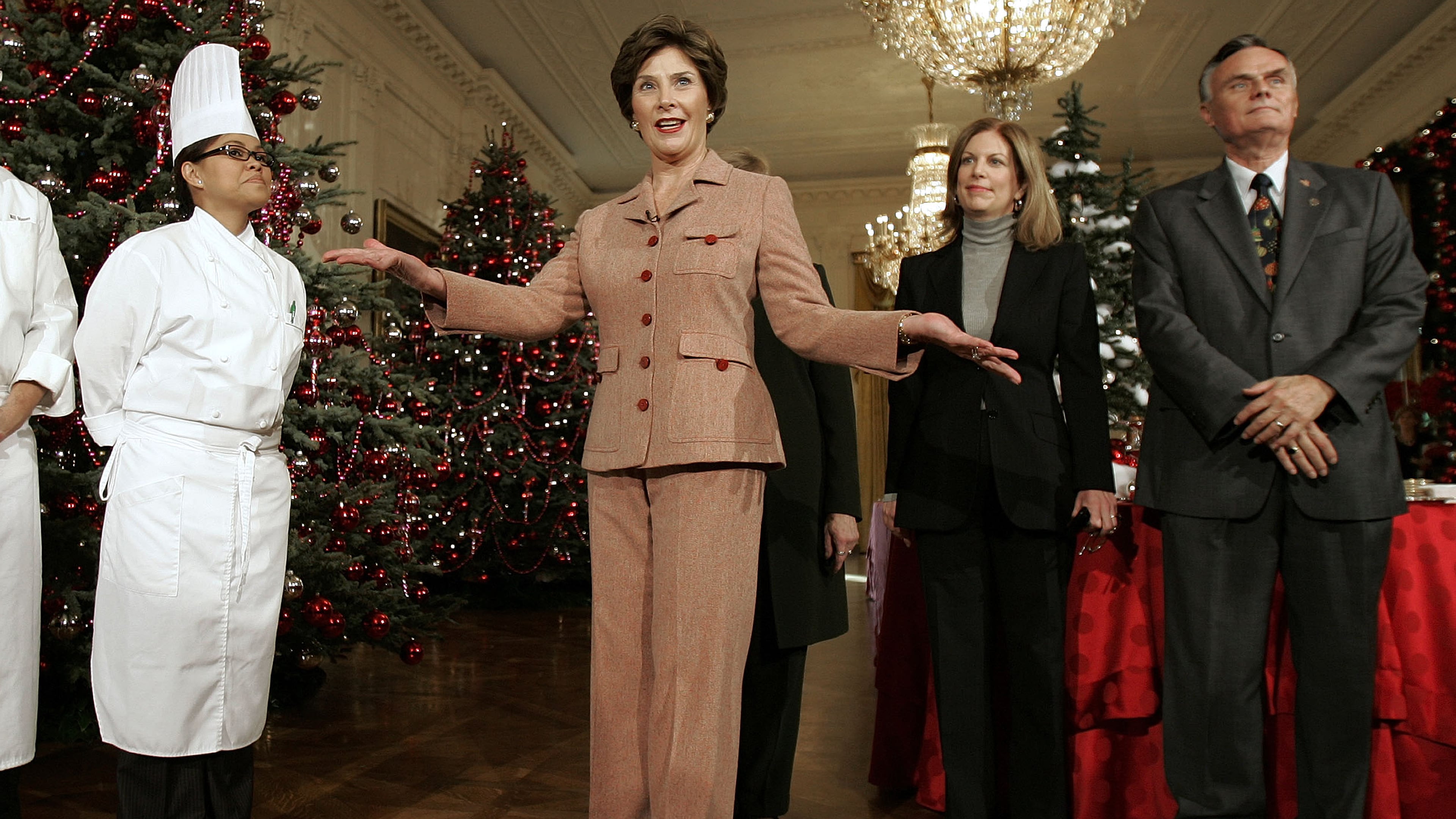 FILE - First lady Laura Bush, center, introduce from l-r, White House Chef Cris Comerford, White House Social Secretary Lea Berman, and White House Usher Gary Walters,as she hosts a media preview of the 2006 holiday decorations at the White House in Washington, Thursday, Nov. 30, 2006. (AP Photo/Ron Edmonds, File)