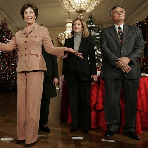 FILE - First lady Laura Bush, center, introduce from l-r, White House Chef Cris Comerford, White House Social Secretary Lea Berman, and White House Usher Gary Walters,as she hosts a media preview of the 2006 holiday decorations at the White House in Washington, Thursday, Nov. 30, 2006. (AP Photo/Ron Edmonds, File)