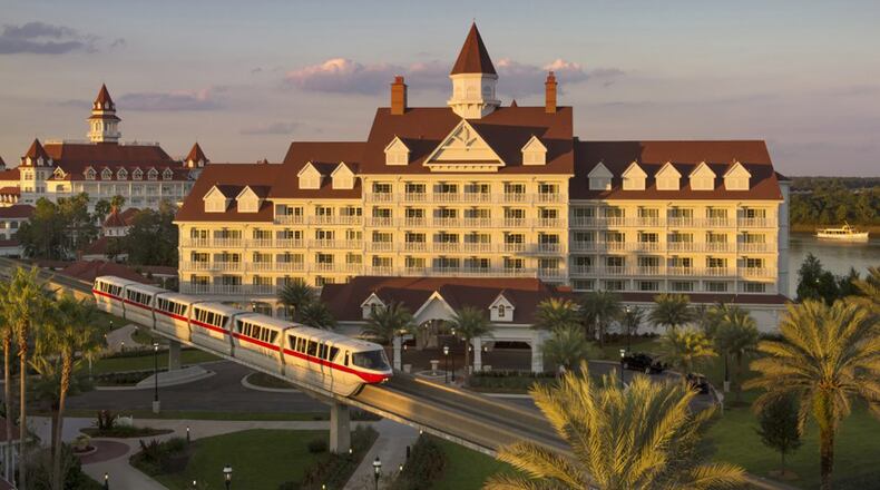 FILE PHOTO: A Monorail drives by The Grand Floridian Resort at Walt Disney World. A door became unhinged on a Monorail cars after a person on a motorized scooter hit the door Tuesday.
