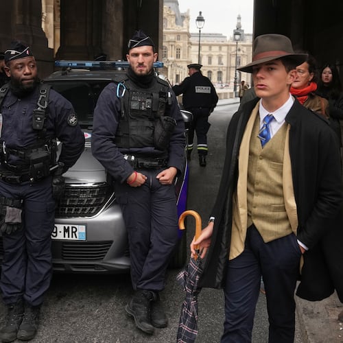 Police officers block an access to the Louvre museum after a robbery Sunday, Oct. 19, 2025, in Paris. (AP Photo/Thibault Camus)