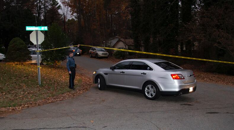 Crime scene tape blocks the entrance to Barnaby Court from Candlewick Lane, where Gwinnett County police were investigating a homicide Friday morning.