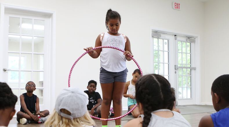 June 5, 2019 Cobb County: Kaleyah Halley presents her hula hoop to fellow campers during social emotional learning time at the ‘Water is Life’ collaborative youth enrichment camp on Wednesday, Jun. 5, 2019, at the Austell Youth Innovation Center in Austell, Georgia. The goal of the Youth Innovation Center is to provide enrichment opportunities and improve graduation rates for youth in the surrounding community. The center opened on a site previously hit by the 2009 floods. (Christina Matacotta/christina.matacotta@ajc.com)