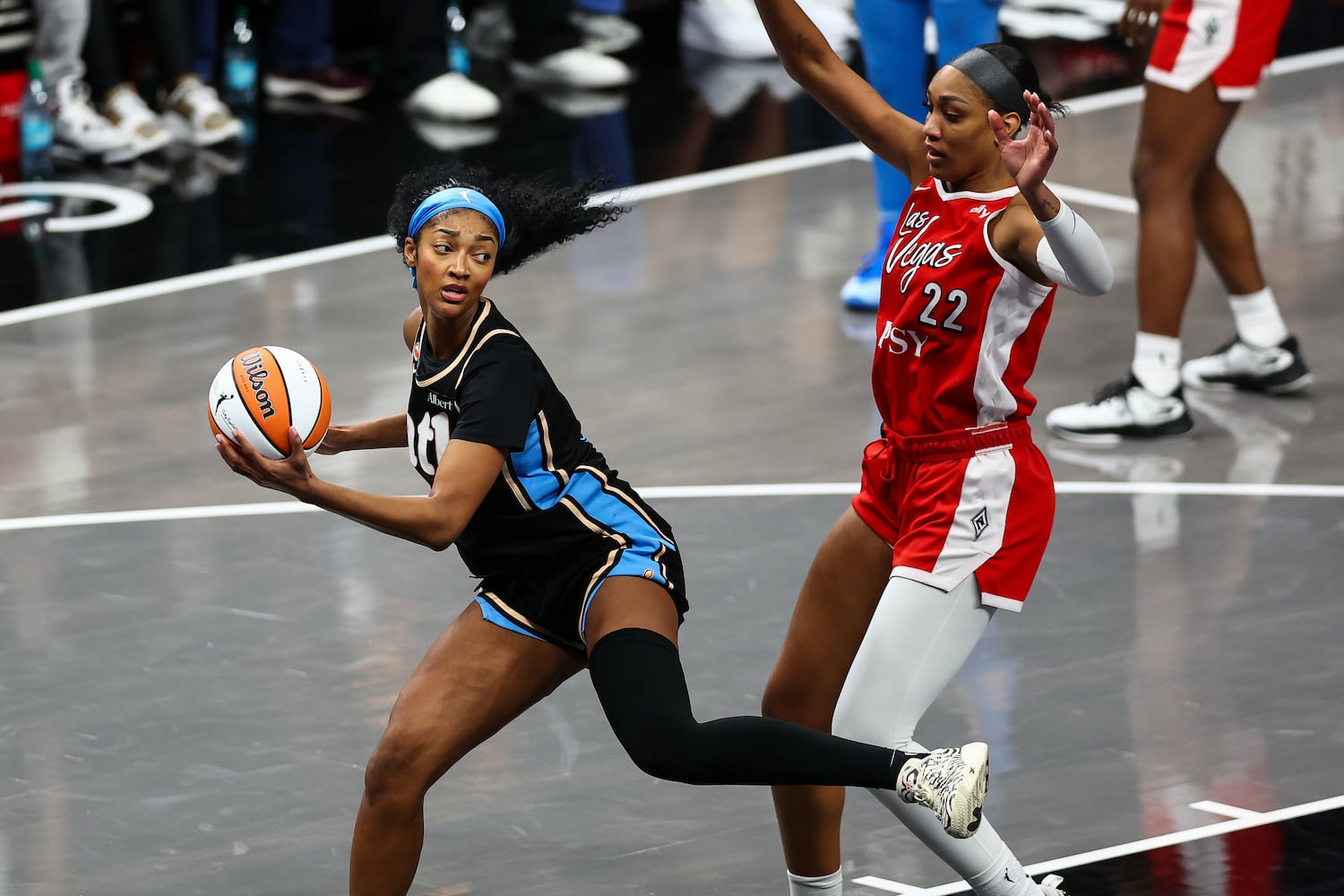 Atlanta Dream forward Angel Reese, left, catches a pass against Las Vegas Aces center A'ja Wilson, right, during the second half of a WNBA game at State Farm Arena on Sunday, May 17, 2026, in Atlanta. (Colin Hubbard for the AJC) 
