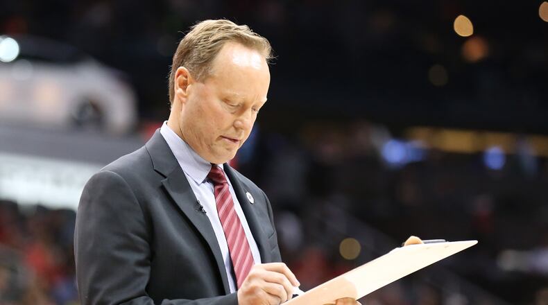 041916 ATLANTA: Hawks head coach Mike Budenholzer draws up a play during a time out against the Celtics in their NBA Eastern Conference first round playoff game at Philips Arena on Tuesday, April 19, 2016. Curtis Compton / ccompton@ajc.com