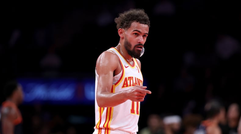 Hawks guard Trae Young celebrates a 108-100 win against the New York Knicks during the quarterfinals of the Emirates NBA Cup on Dec. 11, 2024, in New York. Fans can count on Young to do many a thing, and one of them is putting on a show at Madison Square Garden. (Elsa/Getty Images/TNS)