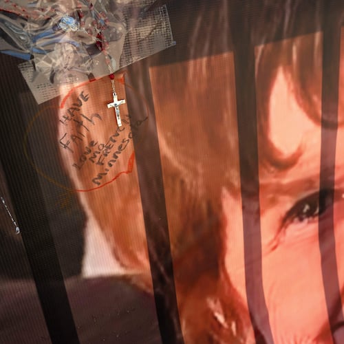 FILE - A banner with notes from hundreds of well-wishers for Nancy Guthrie, the missing mother of "Today" show host Savannah Guthrie, is displayed outside of KVOA Newsroom on March 6, 2026, in Tucson, Ariz. (AP Photo/Rebecca Noble, File)