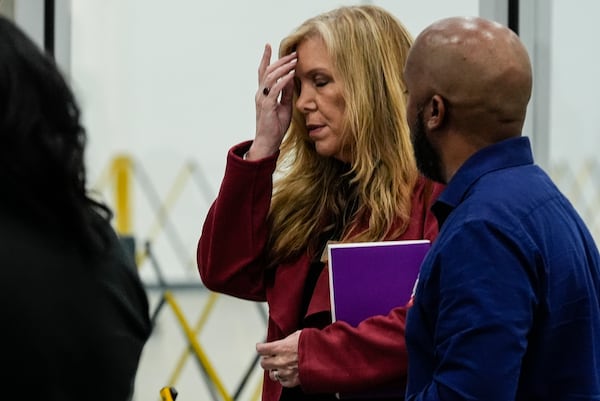 FILE - Fulton County election board member Julie Adams walks at the Fulton County Election Hub and Operation Center on Nov. 5, 2024, in Atlanta. (AP Photo/John Bazemore, File)