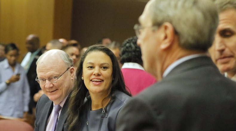 Attorney Charles Huddleston (left) and Meria Carstarphen, superintendent of Atlanta Public Schools, are all smiles after DeKalb Judge Alan Harvey agreed in November to allow Fulton County collect tax money. A number of proposals would change taxing rules for jurisdictions across the county. BOB ANDRES /BANDRES@AJC.COM AJC FILE PHOTO