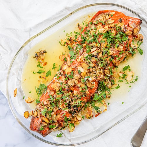 Roast Salmon Almondine makes for an elevated — yet quick — holiday meal. (Aaliyah Man for the AJC/food styling by Kate Williams)