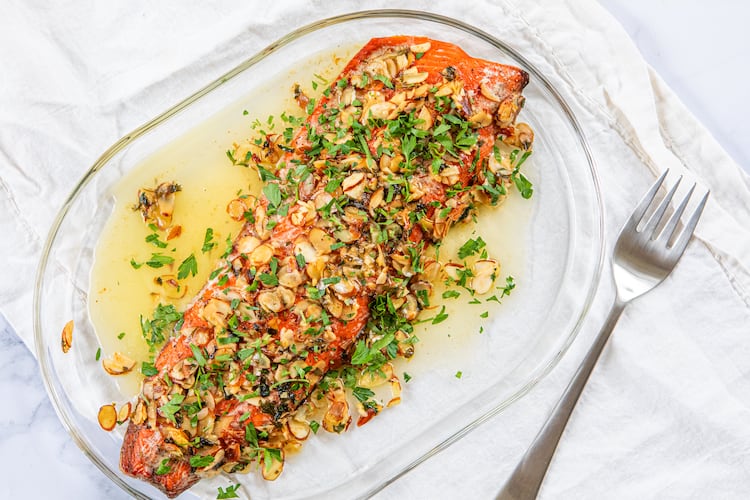 Roast Salmon Almondine makes for an elevated — yet quick — holiday meal. (Aaliyah Man for the AJC/food styling by Kate Williams)