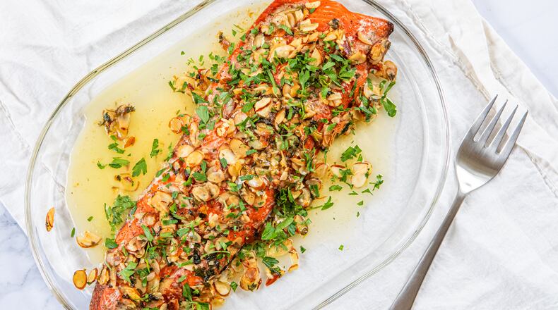 Roast Salmon Almondine makes for an elevated — yet quick — holiday meal. (Aaliyah Man for the AJC/food styling by Kate Williams)