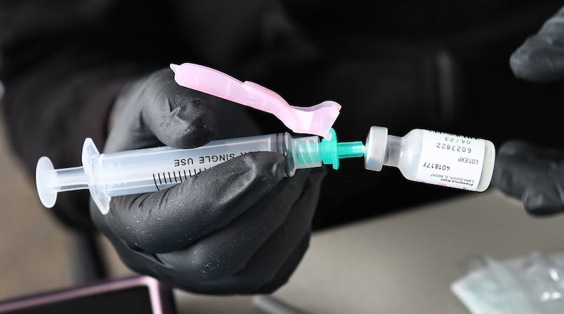 Atlanta Public Schools will provide COVID-19 vaccinations at high school basketball games. Curtis Compton / AJC FILE PHOTO