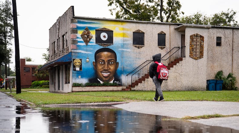 A mural of Ahmaud Arbery is painted on the Brunswick African American Cultural Center. (Nicole Craine/The New York Times)