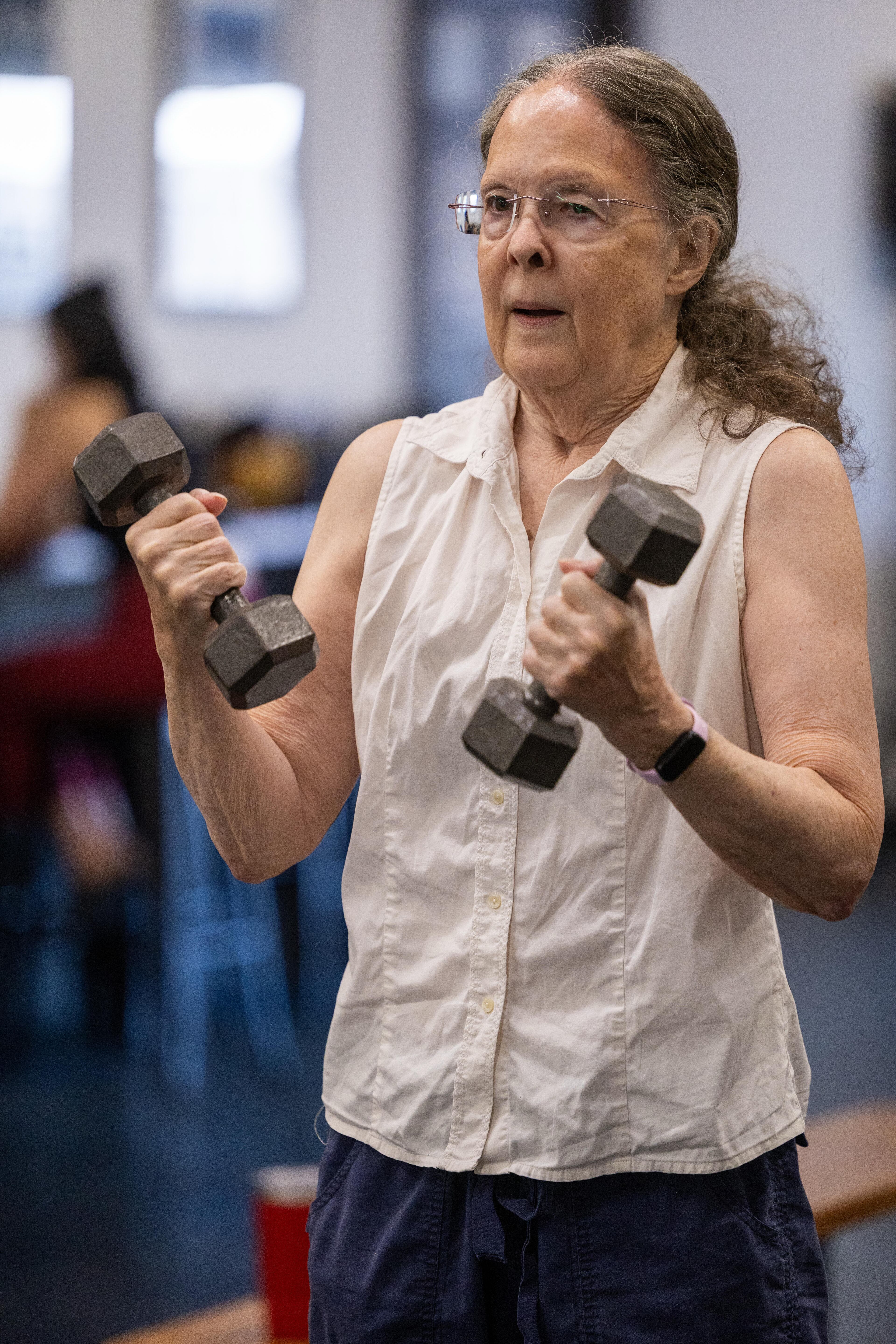 Carolyn Olive lifts weights to build her strength, which is part of the program.(Phil Skinner for the AJC)