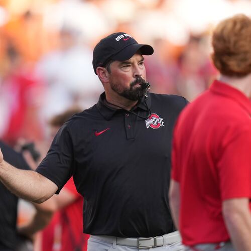 Ohio State head coach Ryan Day watches players warm up before an NCAA college football game against Texas in Austin, Texas, Saturday, Sept. 12, 2026. (AP Photo/Eric Gay)