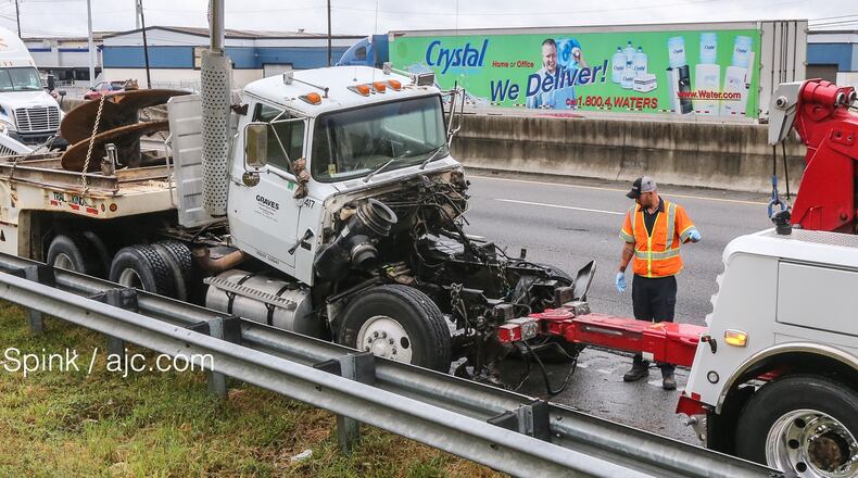 A tractor-trailer jackknifed Tuesday on I-20 in Rockdale County. JOHN SPINK / JSPINK@AJC.COM