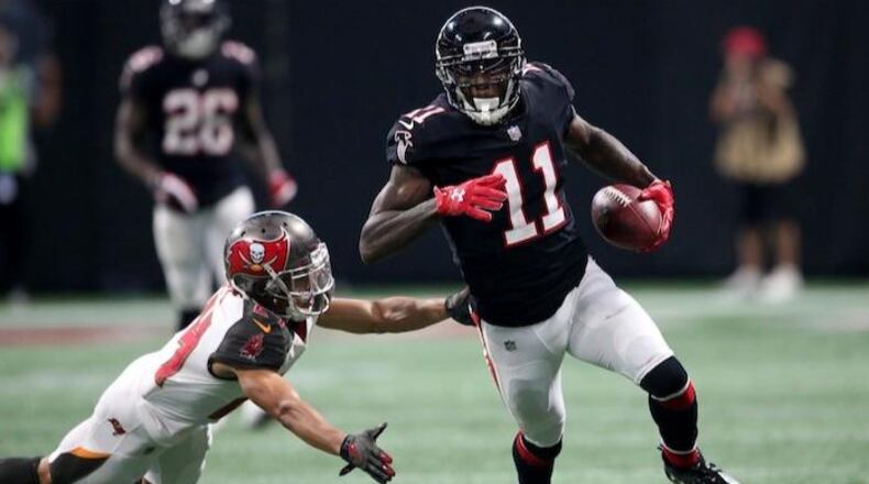 Atlanta Falcons wide receiver Julio Jones (11) runs against Tampa Bay Buccaneers cornerback Brent Grimes (24) during the second half of an NFL football game, Sunday, Nov. 26, 2017, in Atlanta. (AP Photo/John Bazemore)