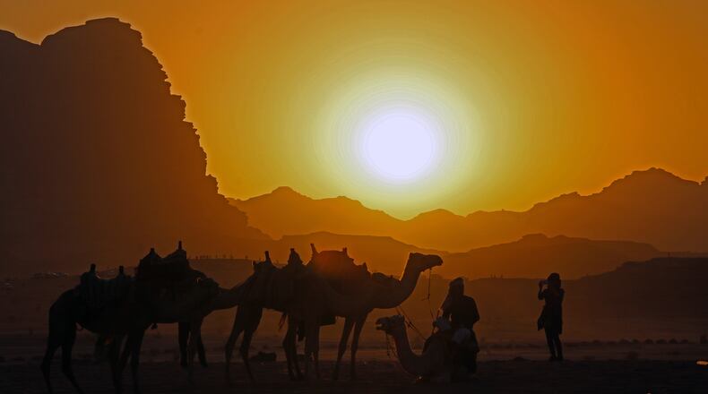 A searing sunset adds more magic to the lunar-like Wadi Rum desert. (Norma Meyer/San Diego Union-Tribune/TNS)