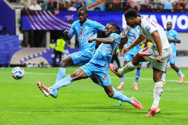 England midfielder Jude Bellingham (10) attempts a kick on goal past Congo defenders Axel Tuanzebe (4) and Aaron Wan-Bissaka (2) during the second half of a FIFA World Cup round of 32 match at Atlanta Stadium (Mercedes-Benz Stadium) on Wednesday, July 1, 2026, in Atlanta. (Jason Getz/AJC)