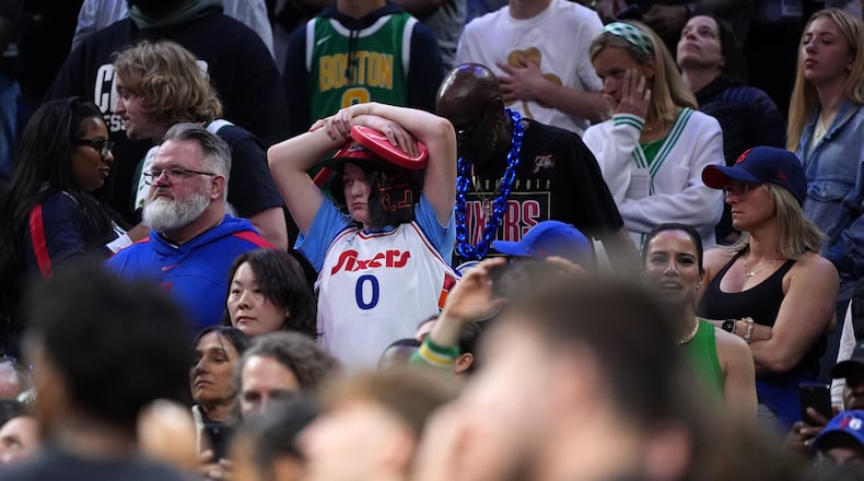 A Philadelphia 76ers' fan reacts during final minute of Game 3 against the Boston Celtics in a first-round NBA playoffs basketball series Friday, April 24, 2026, in Philadelphia. (AP Photo/Matt Slocum)