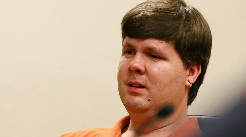 TODDLER DAD REACTS--A tear rolls down the cheek of Justin Ross Harris, the father of a toddler who died after police say he was left in a hot car for about seven hours, as he sits during his bond hearing in Cobb County Magistrate Court, Thursday, July 3, 2014, in Marietta, Ga. Harris who police say intentionally killed his toddler son by leaving the boy inside a hot SUV was exchanging nude photos with women the day his son died and had looked at websites that advocated against having children, a detective testified Thursday. At that same hearing, a judge refused to grant bond for Harris, meaning he will remain in jail. (AP Photo/Marietta Daily Journal, Kelly J. Huff, Pool)