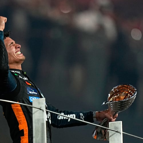 McLaren driver Lando Norris of Britain celebrates after becoming a world champion after the Formula One Abu Dhabi Grand Prix at the Yas Marina Circuit in Abu Dhabi, UAE, Sunday, Dec. 7, 2025. (AP Photo/Fatima Shbair)