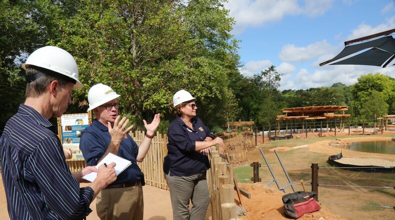 Raymond B. King, president and CEO at Zoo Atlanta (center), and Dr. Hayley Murphy (right) deputy director of Zoo Atlanta, speak to an AJC reporter about the new African Savanna elephant habitat.