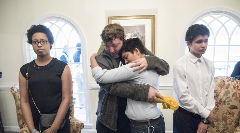 Mourners console each other after a memorial service Sunday, Oct. 8, honoring Scout Schultz, the Georgia Tech student shot and killed Sept. 16 by a campus police officer. (JOHN AMIS / SPECIAL TO THE AJC)