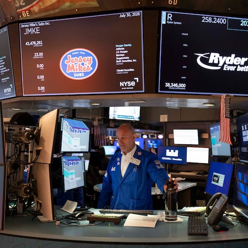 Specialist Mark Fitzgerald works on the floor of the New York Stock Exchange, Thursday, July 30, 2026, in New York. (AP Photo/Yuki Iwamura)