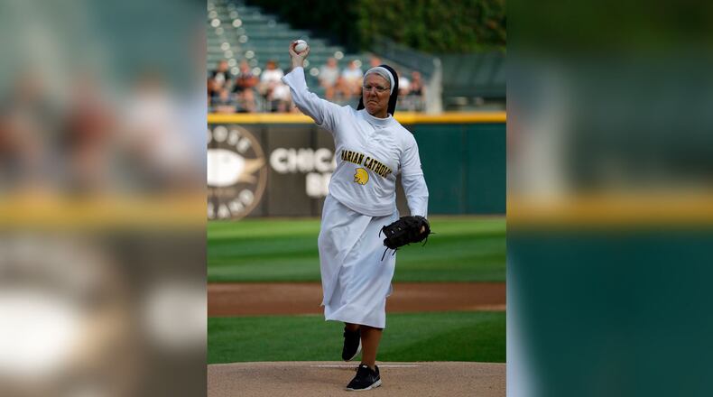 Sister Mary Jo Sobieck throws out a ceremonial first pitch before a baseball game between the Kansas City Royals and the Chicago White Sox, Saturday, Aug. 18, 2018, in Chicago. (AP Photo/Nam Y. Huh)