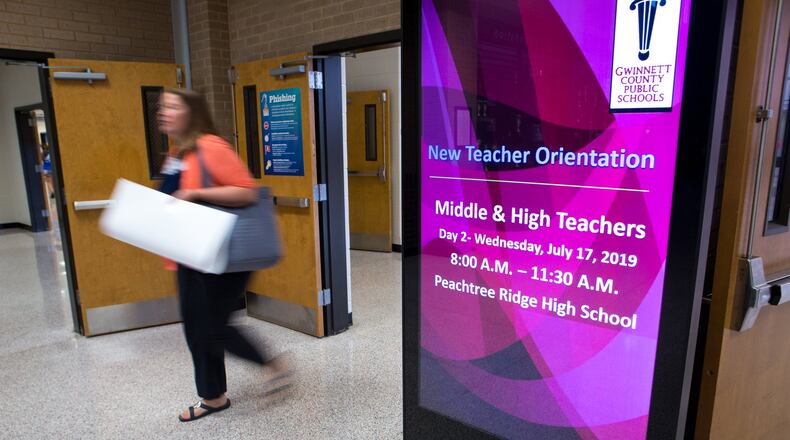 A Gwinnett County Public Schools educator leaves a new teacher orientation at Peachtree Ridge High School in Suwanee on July 17, 2019. CASEY SYKES FOR THE ATLANTA JOURNAL-CONSTITUTION