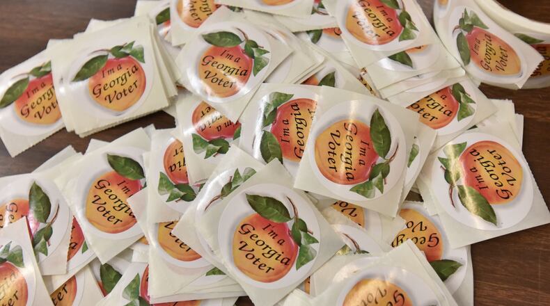Georgia voting stickers. HYOSUB SHIN / HSHIN@AJC.COM