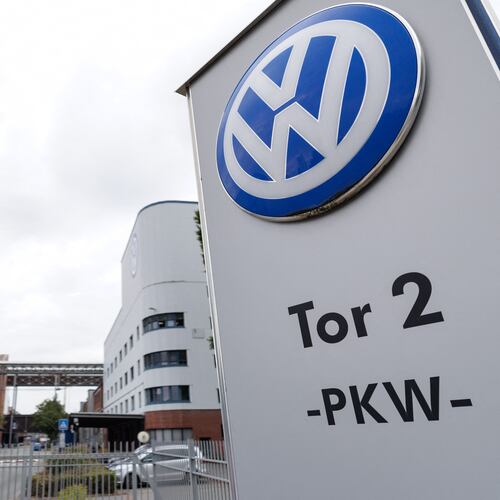 The VW logo in front of the Volkswagen plant in Osnabrueck, Germany, Wednesday, Aug. 26, 2026. (David Ebener/dpa via AP)