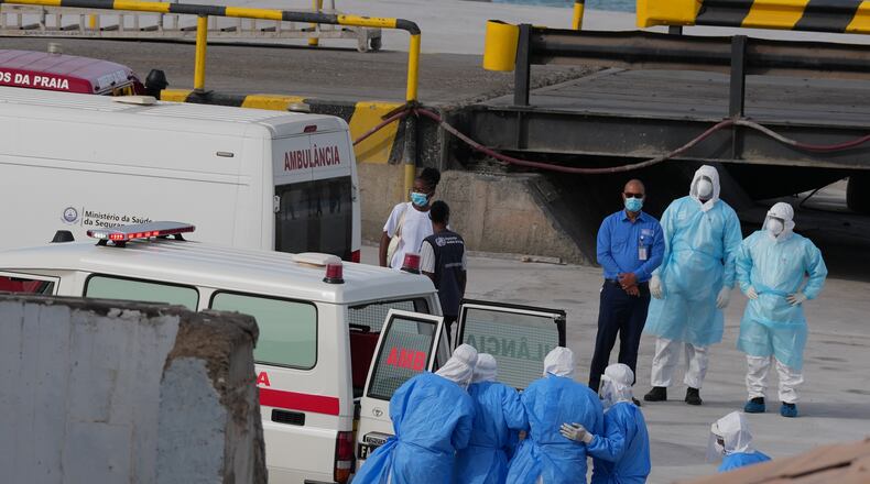 Health workers in protective gear evacuate patients from the MV Hondius cruise ship into an ambulance at a port in Praia, Cape Verde, Wednesday, May 6, 2026. (AP Photo/Misper Apawu)