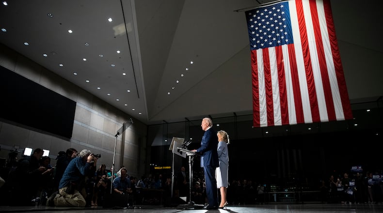 Democratic presidential candidate former Vice President Joe Biden, accompanied by his wife Jill, speaks to members of the press at the National Constitution Center in Philadelphia, Tuesday, March 10, 2020. (AP Photo/Matt Rourke)