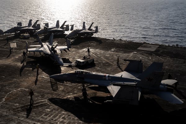 FILE - Figther jets maneuver on the deck of the USS Dwight D. Eisenhower in the Red Sea on Tuesday, June 11, 2024. (AP Photo/Bernat Armangue, File)