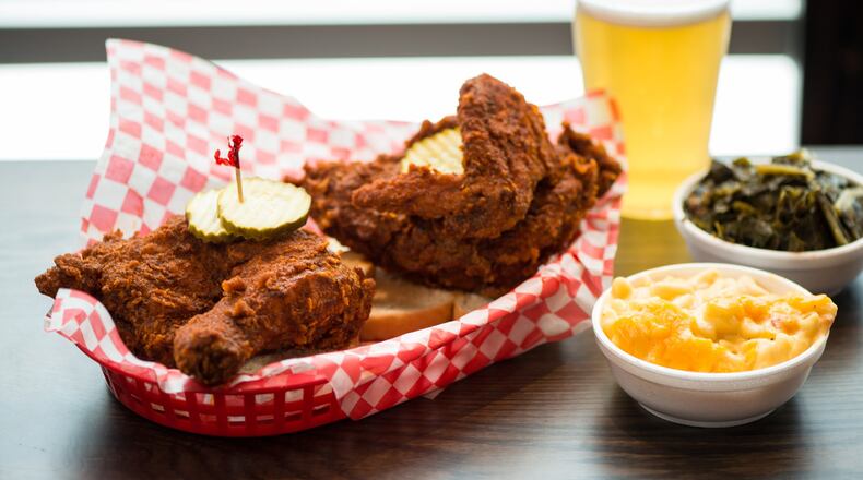 Hattie B's Hot Chicken 1/2 Bird Plate served with two sides, bread, and pickles. Pictured are Pimento Mac and Cheese and Southern Greens sides with a draft beer. Photo credit- Mia Yakel.
