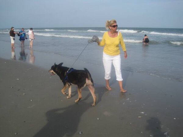 Holly Rogers and Bullet, one of her many rescue dogs. Family photo
