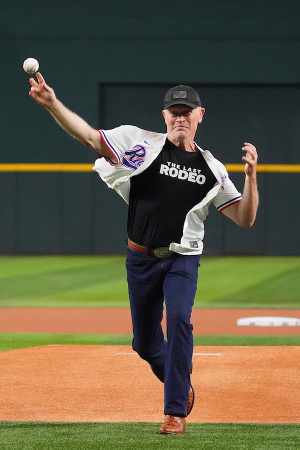 Actor Neal McDonough throws the first pitch of a baseball game between the Colorado Rockies and Texas Rangers, Wednesday, May 14, 2025, in Arlington, Texas. (AP Photo/LM Otero)