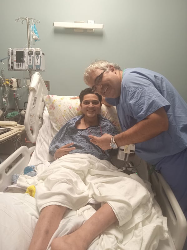 Andrew Miles (center) received an artificial heart in a novel procedure pioneered by Dr. Mani Daneshmand. (Courtesy of Amy Brigdon)