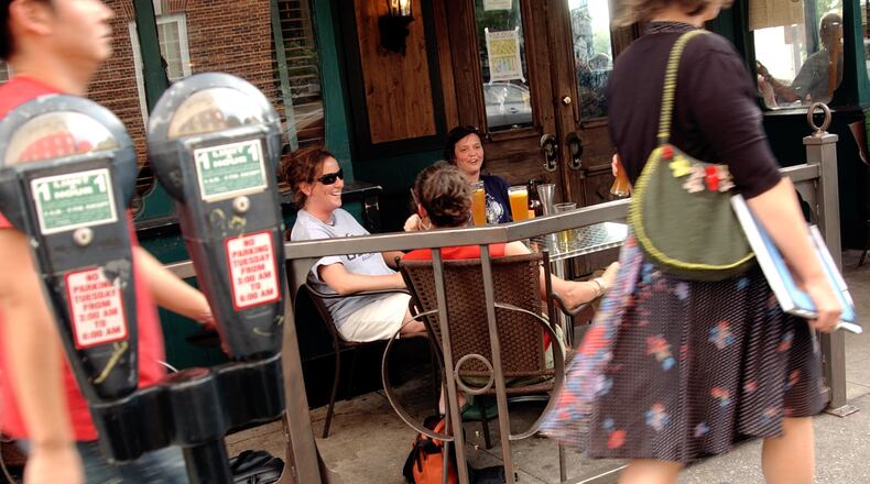People stroll along Lumpkin Street in front of The Globe. / AJC file photo