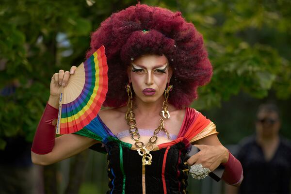 A participant in the Bucharest Pride Parade strikes a pose in Bucharest, Romania, Saturday, June 7, 2025. (AP Photo/Vadim Ghirda)
