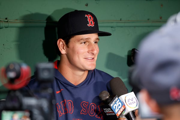 Boston Red Sox outfielder Roman Anthony speaks with the media in the dugout before making his first major league start in a baseball game against the Tampa Bay Rays at Fenway Park, Monday, June 9, 2025, in Boston. (AP Photo/Mary Schwalm)